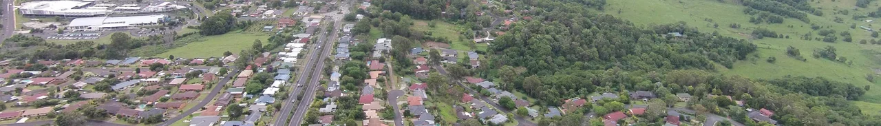 Photo from air of Goonellabah NSW, Australia, showing the Bruxner Highway, and Goonellabah Shopping Centre in the distance.