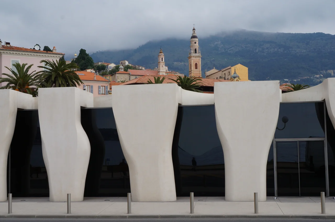 The old town on Menton, with the Saint-Michael cathedral, the cemetary at the top of the hill and in the foreground the new museum Cocteau (Alpes-Maritimes, France).