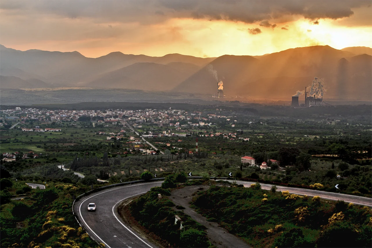 Megalopoli, Peloponnese, Greece. Town and plain heavily air-polluted by lignite, surface mined and burned in two powerstations southwards and westwards of the town. View south