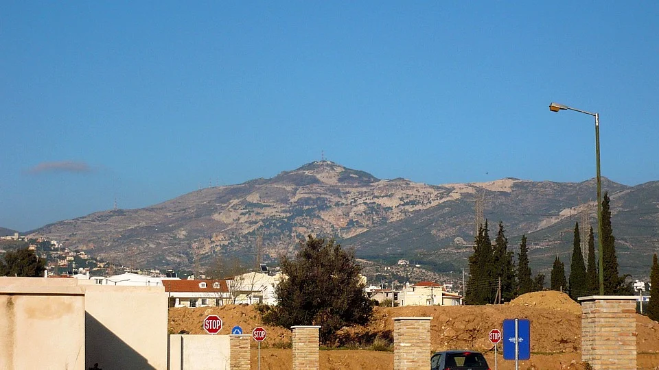 The picture depicts the Penteli Mountain as seen by the Cemetery belt from Gerakas of East Attica/Greece.