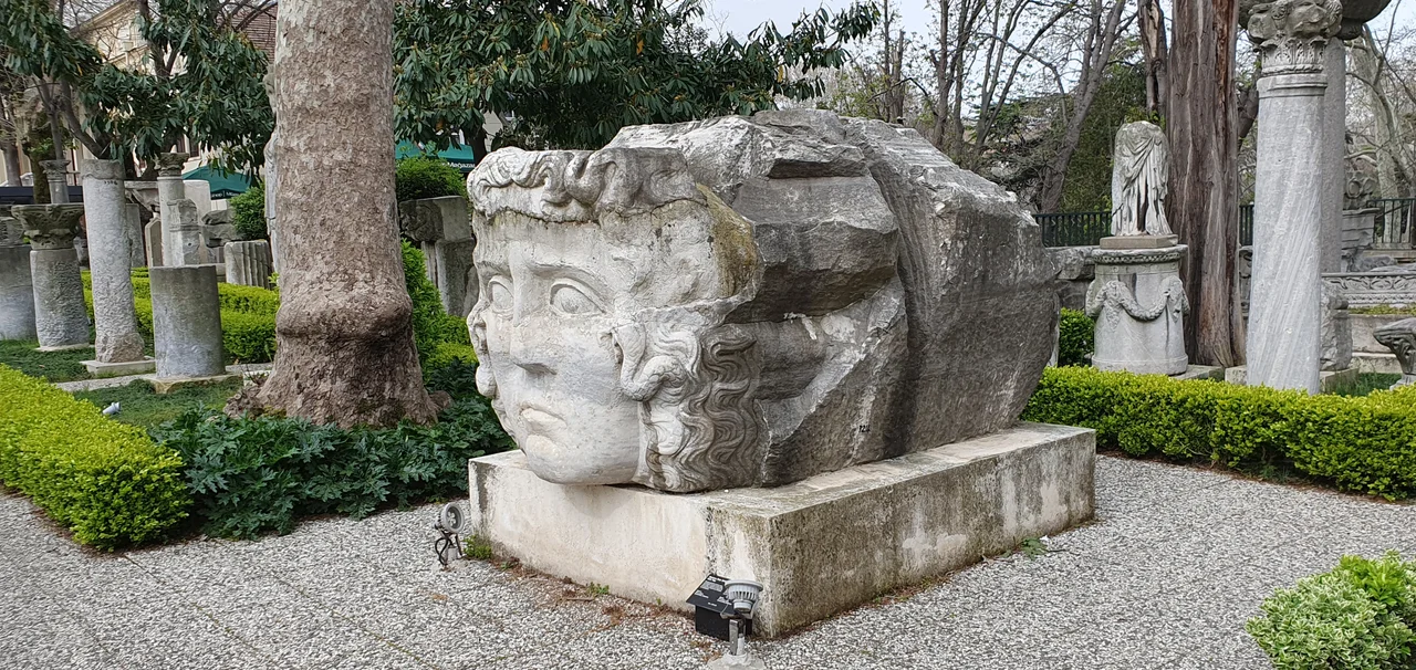 This huge key stone which was found in Çemberlitaş may belong to a big arch at the Forum of Constantine. The forum was built by Constantine I in the quarter of today's Çemberlitaş. It was oriented north-south, the forum was oval in its ground plan. Historical sources report that located within the forum was:
- a Senate House or basilica, a monumental fountain or nymphaeum, and silversmith and chandler shops.

The pavement was of marble. On the periphery it was ornamented by statuary and reliefs. An honourific column dedicated to Constantine I was erected in its centre. A place of worship devoted to the emperors, known as Hagios Constantinos, was constructed on the rectangular base of the monument. One of the official imperial ceremonies was held here. Basil I the Macedonian constructed the Church of St. Mary (Theotokos) on one of the porticoes.
