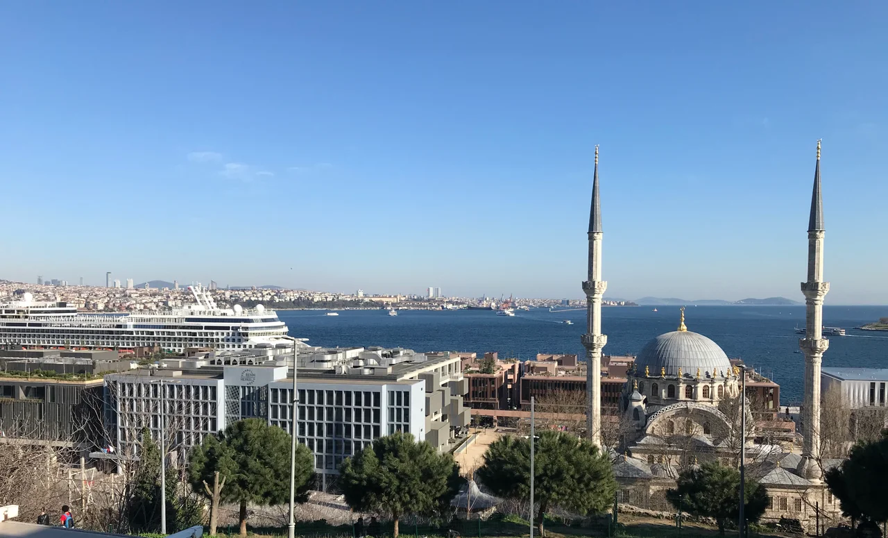 Overview of Galataport from Cihangir showing Istanbul Painting and Sculpture Museum on left and Nusretiye Mosque on right with Asian shore and Princes' Islands in the background