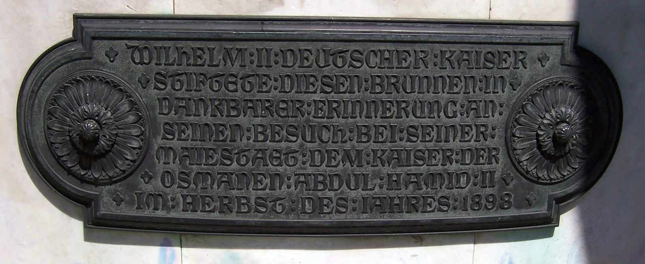 Alman Çeşmesi, Sultanahmet, Istanbul, Turkey. The bronze inscription on reservoir, which was written in German, reads "Wilhelm II Deutscher Kaiser Stiftete Diesen Brunnen In Dankbarer Erinnerung An Seinen Besuch Bei Seiner Majiestaet Dem Kaiser Der Osmanen Abdul Hamid II Im Herbst Des Jahres 1898" meaning "German Kaiser Wilhelm II, who constructed this fountain in 1898 autumn, as a gratitude remembrance for his visit to Ottoman Sultan Abdülhamid II".