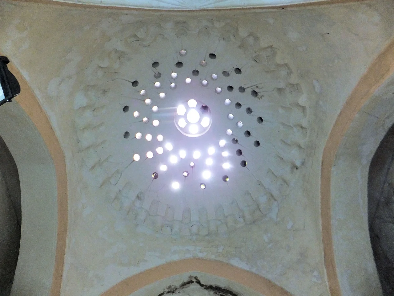 Mahmut Pasha Hamam, probably part of the Mahmut Pasha külliye (complex) which included the nearby Mahmut Pasha Mosque. This is one of the oldest Ottoman hamams in the city but is now used as a shopping or boutique center.
According to Dogan Kuban ("Ottoman Architecture", 2010) it is dated to 1466, though another guidebook to the city ("Strolling Through Istanbul", 2010 edition) it is dated to 1476. (One of those might be a typo of the other.)