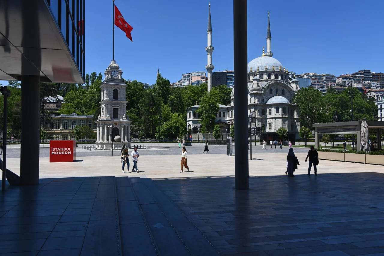 e of a square behind Galataport with the Nusretiye Mosque behind it
