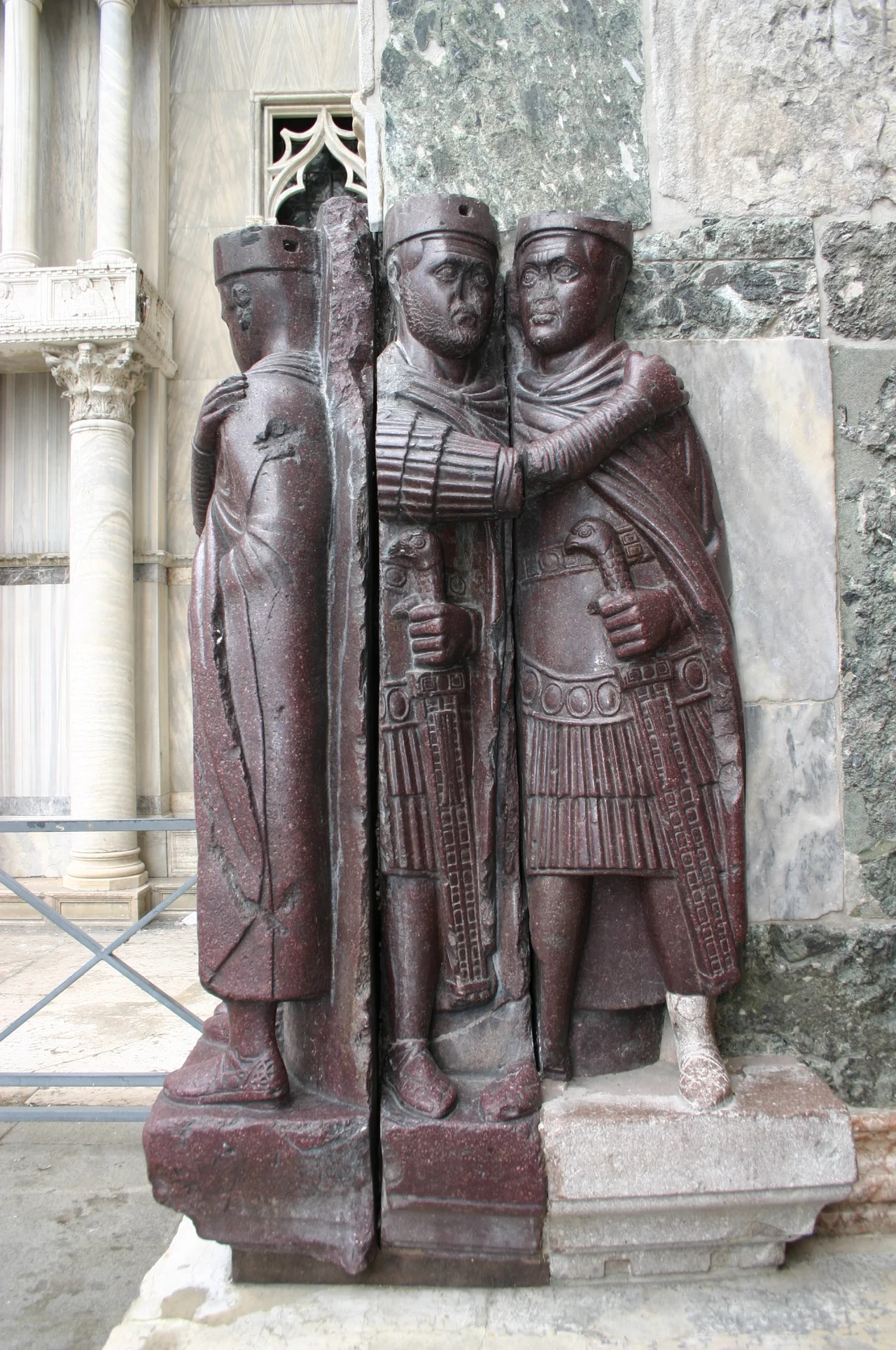 The tetrarchs (from the Greek words for "Four rules") were the four co-rulers that governed the Roman Empire as long as Diocletian's reform lasted. Here they were portraied embracing, in sign of harmony, in a porphyry sculpture dating from the 4th century, produced in Asia Minor, today on a corner of Saint Mark's in Venice, next to the "Porta della Carta". Picture by Giovanni Dall'Orto, August 8, 2007.