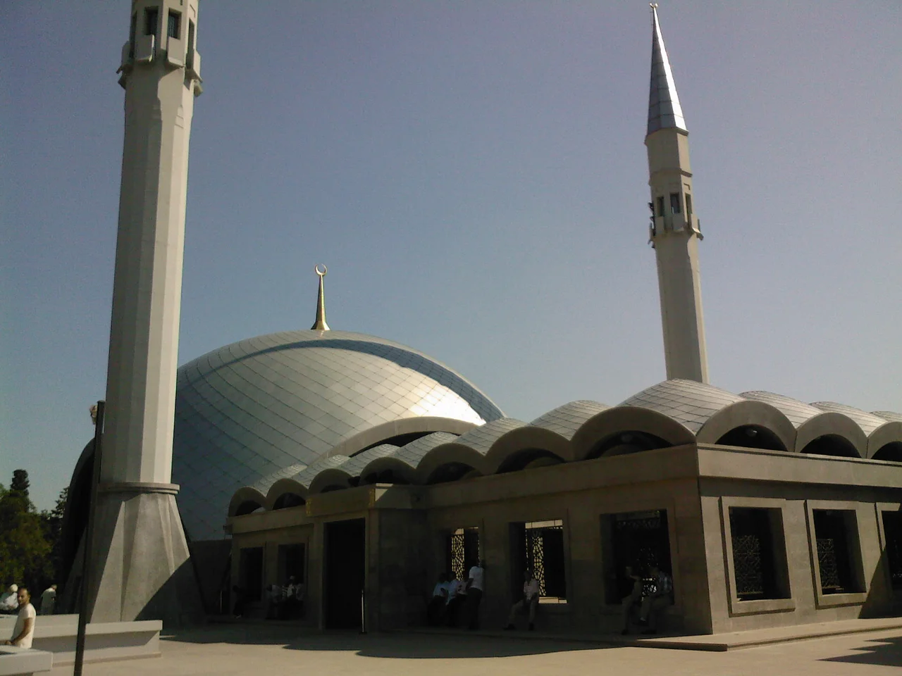 Façade, with dome, minarets, and undulating roof, of Şakirin mosque, in Üsküdar, Istanbul, Turkey.