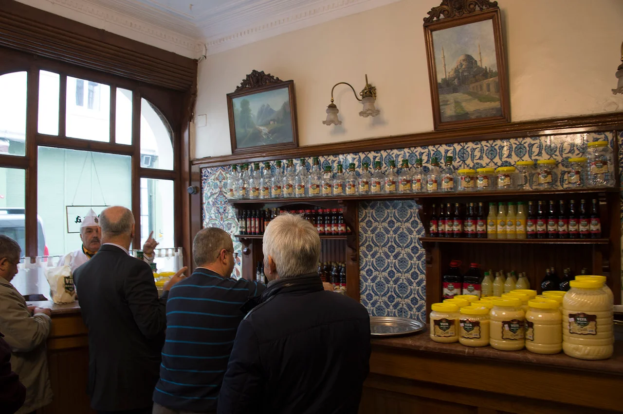 From the Wikipedia article: In 1876, brothers Haci Ibrahim and Haci Sadik established a boza shop in the Istanbul district of Vefa, close to the then center of entertainment, Direklerarası. This boza, with its thick consistency and tart flavor, became famous throughout the city, and is the only boza shop dating from that period still in business today. The firm is now run by Haci Sadik and Haci Ibrahim's great-great-grandchildren.