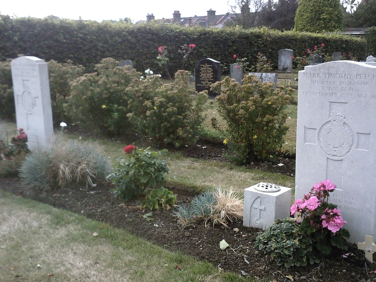 Part of Hamilton Road Cemetery, Deal, Kent. On the edge of the photo at the right is the Commonwealth War Graves Commission headstone of musician Mark Petch, killed by the IRA in the Deal barracks bombing in 1989.