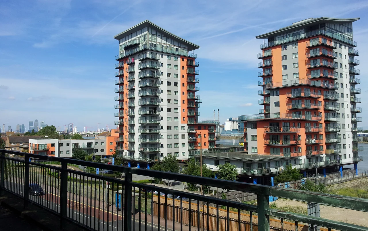 View of the river Thames and the Mast Quay buildings from the belvedere in Saint Mary's Gardens, Woolwich, South East London.