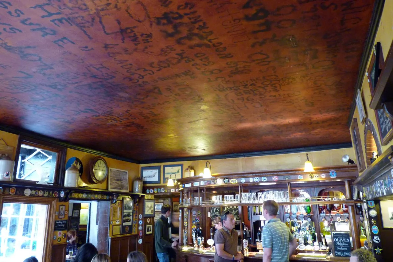 The Eagle pub in Cambridge with graffiti of World War II airmen covering the ceiling.