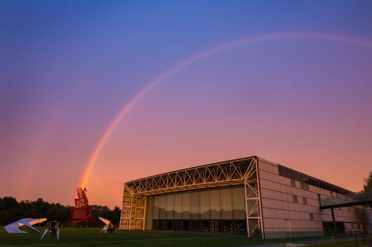 The Sainsbury Centre building with surrounding sculptures.