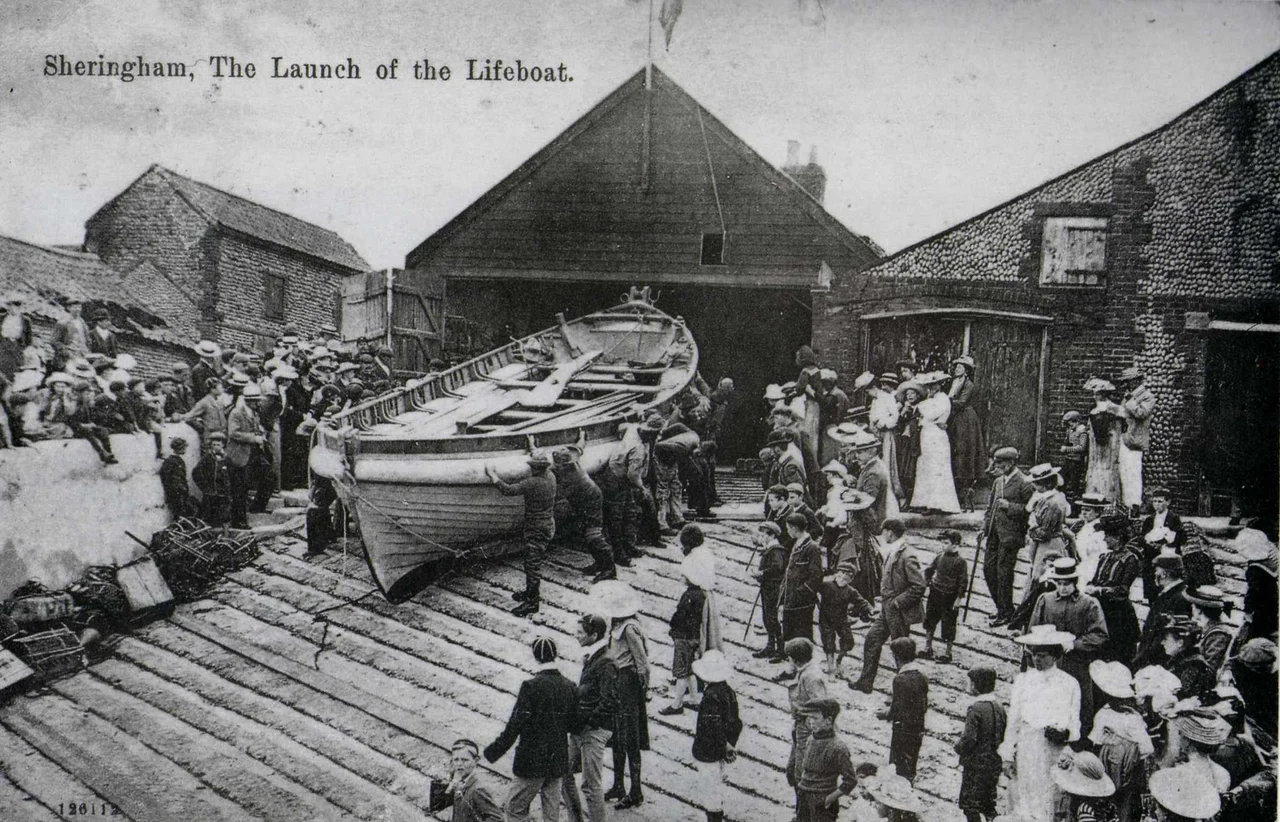 Post card image dated cica 1904 of the Sheringham lifeboat Henry Ramey Upcher outside her boathouse