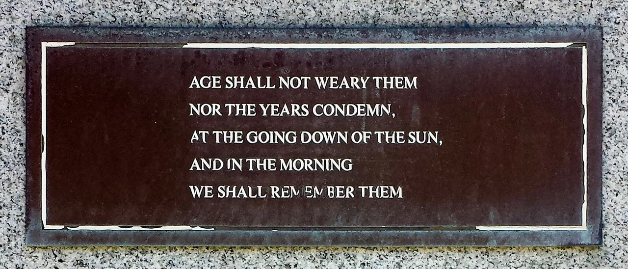The plaque on the south-west side of the RAF North Coates Strike Wing War Memorial in Cleethorpes. The plaque quotes Ode of Remembrance, from Laurence Binyon's poem, For the Fallen, which is often recited at memorial services in the UK.