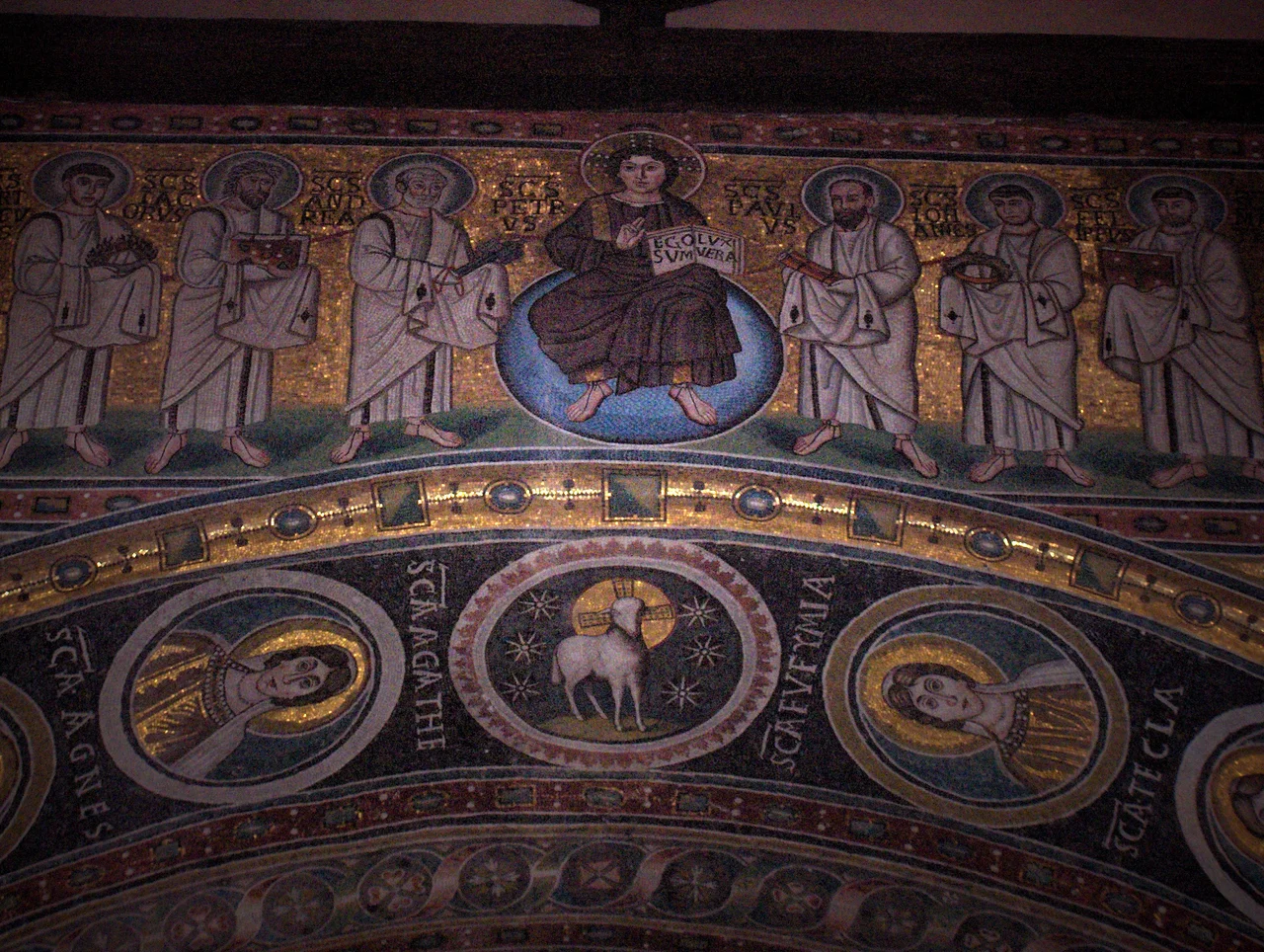 Mosaic with young Christ holding a book with the text "Ego sum lux vera" (I am the true light); on His left and right : six apostles;apse of the St. Euphrasius basilica, Poreč, Croatia