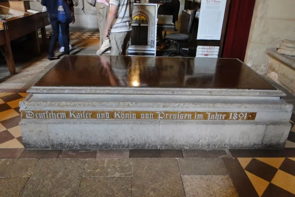 Memorial to medieval princes of Anhalt from the House of Ascania who are buried within the church. The inscription from 1891 honours Prussian king and German Emperor Wilhelm II. who had encouraged the renovation of the church.
