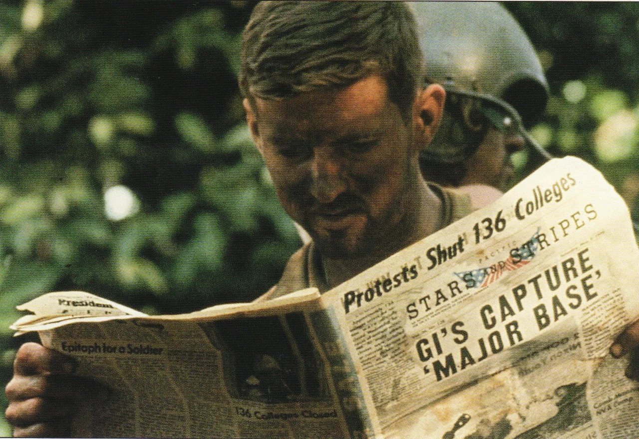 American soldier during the Cambodian Campaign, reading the Stars and Stripes