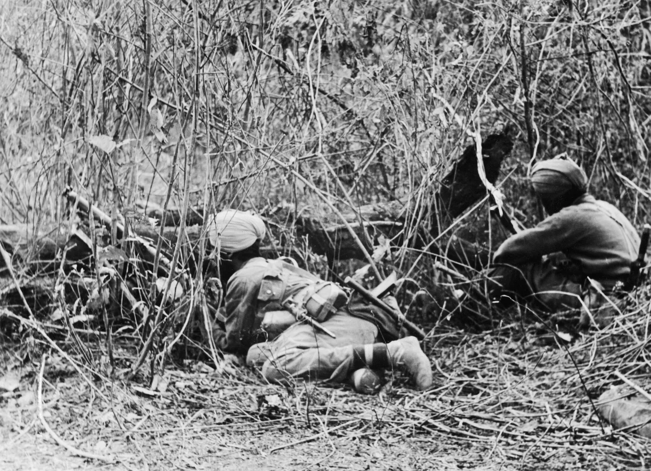 THE WAR IN THE FAR EAST: THE BURMA CAMPAIGN 1941-1945, The Arakan Campaign January 1943 - May 1945: Sikhs of the 7th Indian Division at an observation post in the Ngakyeduak Pass area during the fierce fighting which followed the Japanese offensive launched on 6 February 1944.