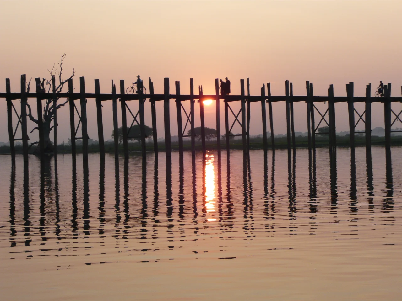 Monks crossing bridge at sunset
I took this picture on vacation in December 2007.
Removed from the following pages:
Amarapura
--OrphanBot (talk) 10:21, 20 February 2008 (UTC)