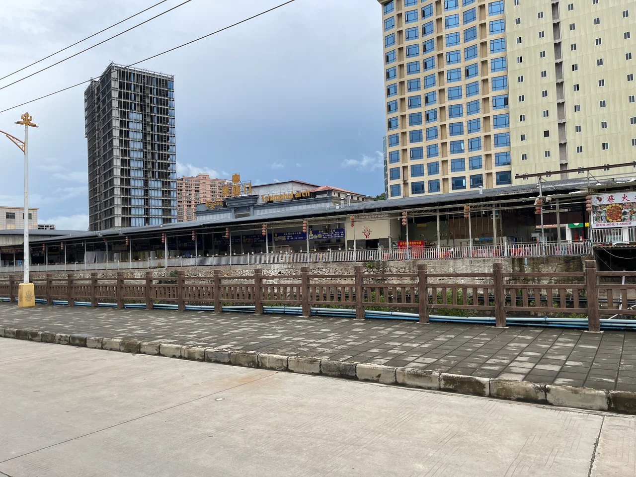 View of the Triumphal Arch area across the Nanma River in downtown Mong La