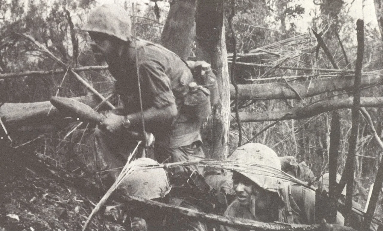 A United States Marine with 3d Battalion, 4th Marines moves forward during Operation Prairie of the Vietnam War.