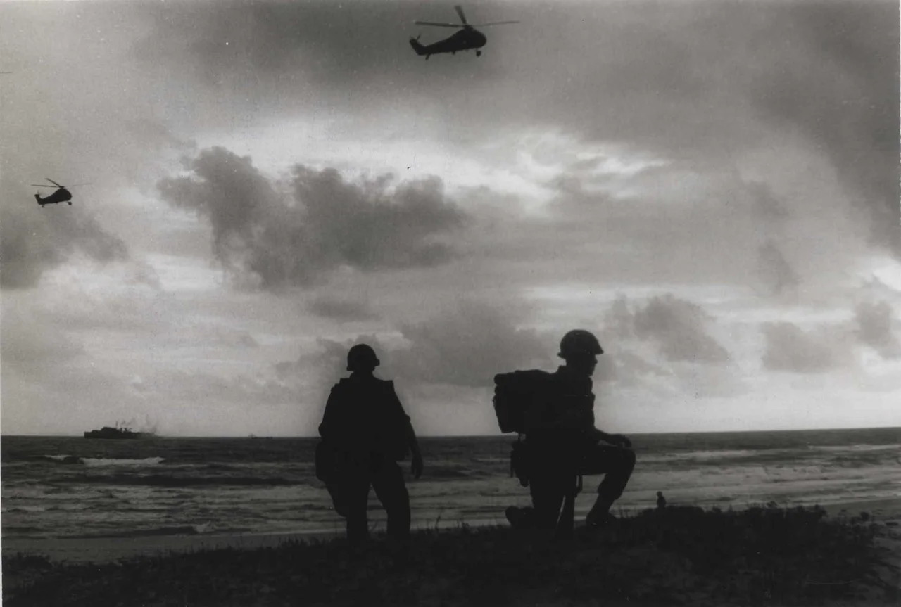 "Secured Beach: Marines of the 26th Marines wait for the word to ‘move out’ after coming ashore to begin Operation Bold Mariner. The Marines came ashore on the Batangan Peninsula in Quang Ngai Province, South Vietnam, in amphibian tractors from ships of the US 7th Fleet. The operation is aimed at digging out the Viet Cong infrastructure in the area (official USMC photo by Corporal Mike Detherage)."
From the Jonathan F. Abel Collection (COLL/3611), Marine Corps Archives & Special Collections
OFFICIAL USMC PHOTOGRAPH