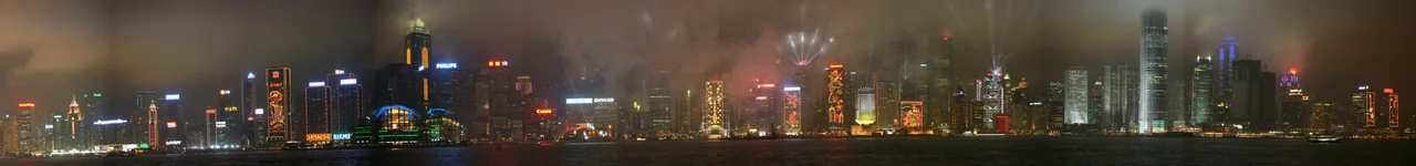w:A Symphony of Lights - This night-time panorama photo shows the Victoria Harbour overlooking the Hong Kong Island with Fireworks and Laser Show at the top of the buildings. Since it was around the Chinese New Year festival, many buildings have colourful decorations on their outer walls.