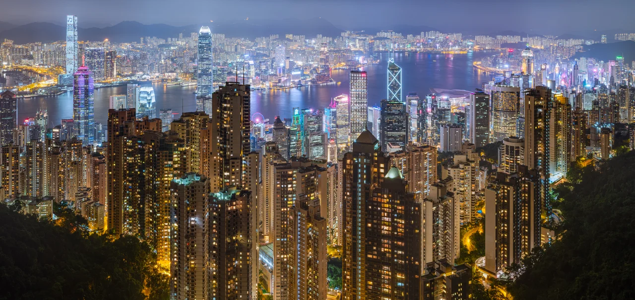 50 mpix panorama of Hong Kong's harbour and skyline, as seen from Victoria Peak on a rainy night of June 2019.