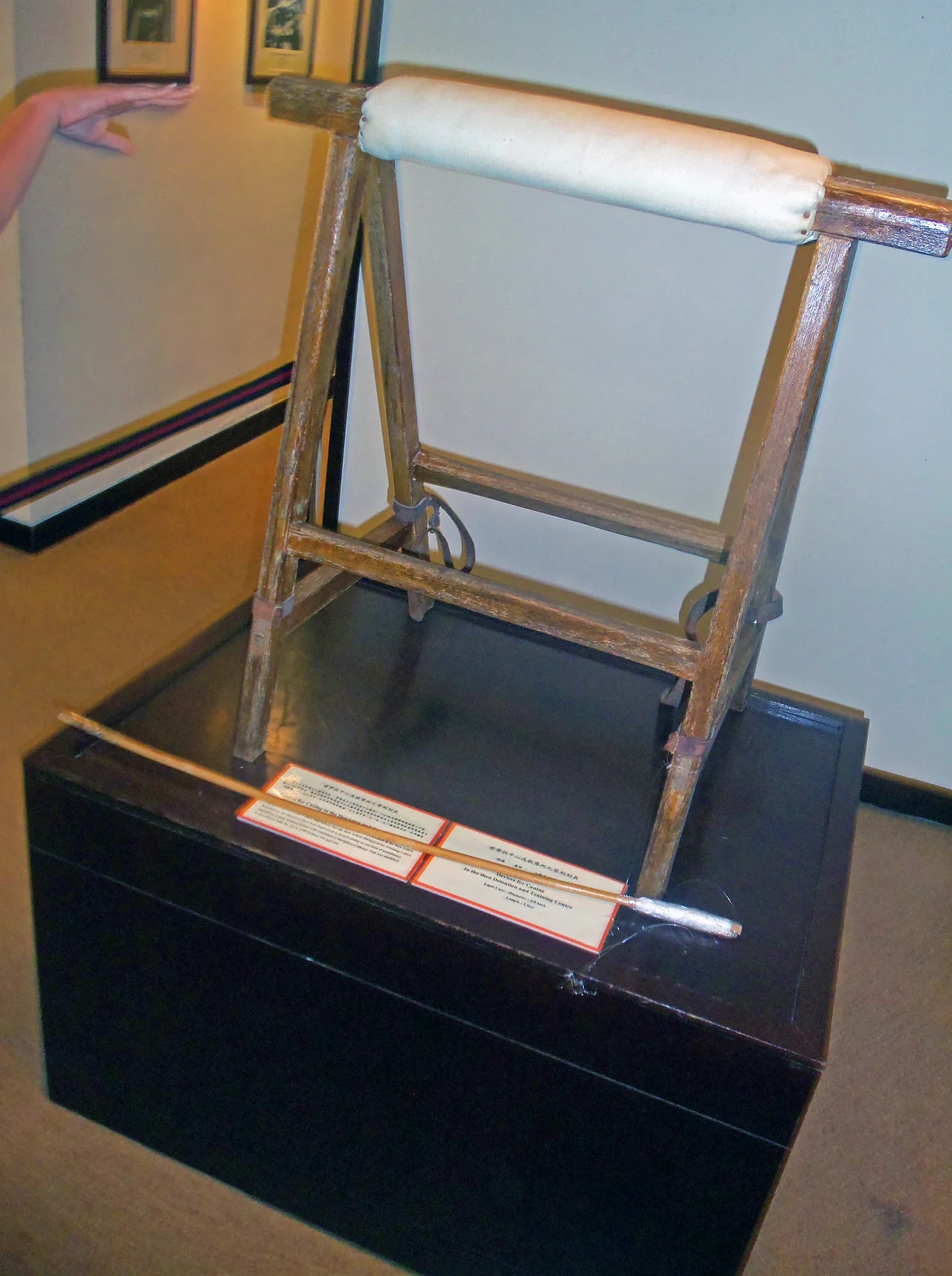 Caning stand and cane formerly used to discipline prisoners in Hong Kong under British colonial rule on display at Hong Kong Correctional Services Museum.