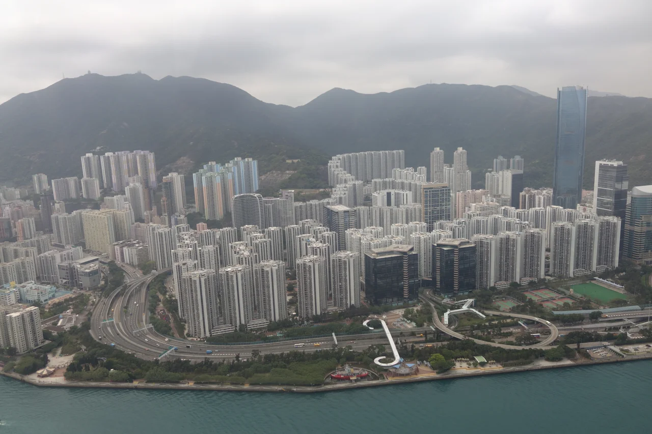 Aerial view of Taikoo Shing portion of the Quarry Bay, One Island East is the tallest building in the photo and Mount Parker, Hong Kong is on the background