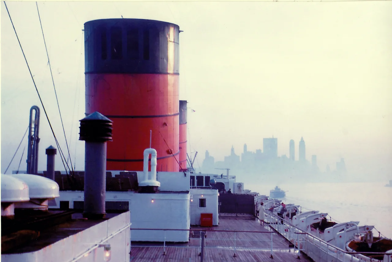 RMS Queen Elizabeth entering New York harbour in 1965, taken from the boat deck, early morning.