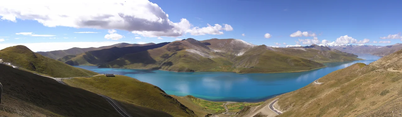 Yamdrok Lake (also called Yamdrok-Tso, Yamdrok Yumtso, and Yamzho Yumco) photographed from the Gamta La pass (at approx. 29°11′N 90°37′E / 29.183°N 90.617°E / 29.183; 90.617) in Tibet.