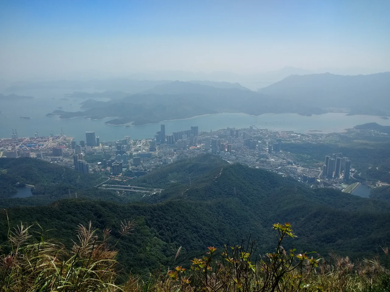 Part of Yantian District (盐田区) and part of the New Territories in Hong Kong, seen from Wutong Mountain (梧桐山) in Shenzhen, China.