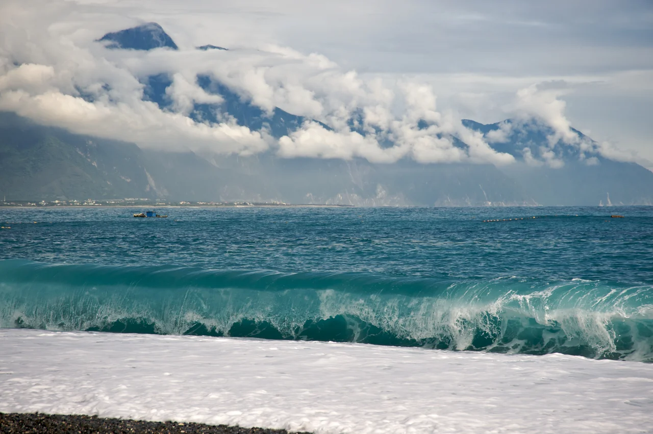 CiSingTan Bay with Fixed-net fishing operations close to shore, and the Central Mountain Range in the background, in Hualien County in Taiwan