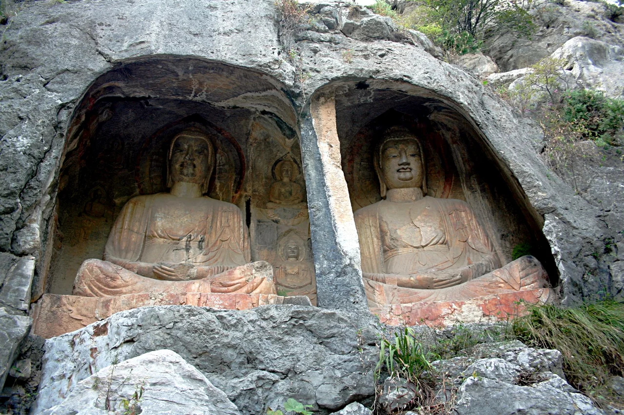Photograph of carved sculptures on the Thousand Buddha Cliff in Shandong Province, China.