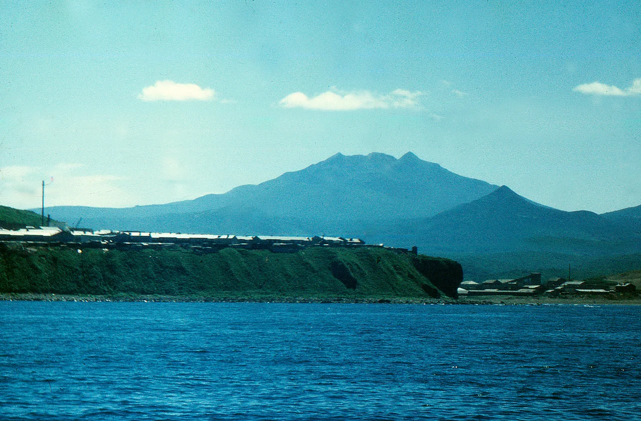 Baransky volcano as seen from the northwest, in Iturup Island, Russia. Kurilsk town in the foregrond.